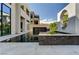 Modern home featuring a stunning pool with a water feature and architectural details at 10752 Patina Hills Ct, Las Vegas, NV 89135