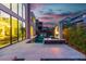 Stunning backyard pool with adjacent water feature offers relaxation and picturesque sunset views at 10752 Patina Hills Ct, Las Vegas, NV 89135
