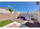 Cozy backyard with a playhouse, gravel landscaping, and an artificial turf area at 1076 Crescent Falls St, Henderson, NV 89011