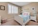 Charming bedroom with plush carpet, window with shutters, and a whimsical bed with bedding at 1076 Crescent Falls St, Henderson, NV 89011