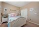 Cozy bedroom with soft carpet, a bed with themed bedding, and a closet with sliding doors at 1076 Crescent Falls St, Henderson, NV 89011