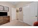 Neutral bedroom featuring carpet flooring, sliding closet, and wood dresser at 1076 Crescent Falls St, Henderson, NV 89011
