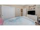 Well-organized bedroom features dresser, sliding door closet, and bed with bedding at 1076 Crescent Falls St, Henderson, NV 89011