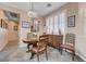 Cozy dining area featuring a round wooden table set and a stylish crystal chandelier at 1076 Crescent Falls St, Henderson, NV 89011