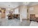 Comfortable dining area with tiled floors, decorative lighting, and living room access at 1076 Crescent Falls St, Henderson, NV 89011
