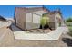 Lovely home featuring a stone landscape, well kept lawn, and an inviting side entrance at 1076 Crescent Falls St, Henderson, NV 89011