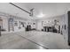 Organized garage featuring epoxy flooring and storage cabinets at 1076 Crescent Falls St, Henderson, NV 89011