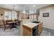 Open-concept kitchen view connecting the dining area, with modern black appliances at 1076 Crescent Falls St, Henderson, NV 89011