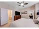 Spacious main bedroom with an ensuite bathroom, a large dresser, and a comfortable bed, perfect for relaxation at 1076 Crescent Falls St, Henderson, NV 89011