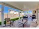 Back patio with full outdoor kitchen and seating areas at 1076 Crescent Falls St, Henderson, NV 89011