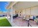 Covered patio with outdoor kitchen and dining area at 1076 Crescent Falls St, Henderson, NV 89011