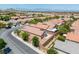 Aerial view of a single-Gathering home with block wall, desert landscaping in a neatly planned community at 11253 Revelry Ln, Las Vegas, NV 89138