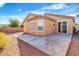 Exterior backyard with a patio area, privacy wall, desert landscape, and view of the home at 11253 Revelry Ln, Las Vegas, NV 89138