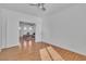 This room boasts a ceiling fan and hardwood floors and an adjoining living room at 11253 Revelry Ln, Las Vegas, NV 89138