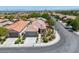 Well-maintained single-story home featuring a tile roof, manicured landscaping, and an attached two-car garage on corner lot at 11253 Revelry Ln, Las Vegas, NV 89138