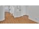 Inviting hallway with hardwood floors, white walls, modern trim and accents, and recessed lighting at 11253 Revelry Ln, Las Vegas, NV 89138