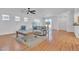 Bright living room features a ceiling fan, recessed lighting, and hardwood floors at 11253 Revelry Ln, Las Vegas, NV 89138