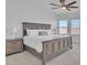 Spacious main bedroom features a ceiling fan, carpet, and bright windows at 11253 Revelry Ln, Las Vegas, NV 89138