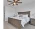 Spacious main bedroom featuring a ceiling fan and a well-lit, relaxing atmosphere at 11253 Revelry Ln, Las Vegas, NV 89138