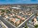 Scenic aerial view of a neighborhood showcasing well-kept homes, streetscapes, and the city skyline at 1201 N Buffalo Dr # 202, Las Vegas, NV 89128