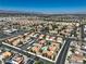 Panoramic aerial of a residential area featuring tidy homes, streets, and mountains in the distance at 1201 N Buffalo Dr # 202, Las Vegas, NV 89128