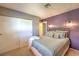 Comfortable bedroom with a queen size bed, soft lighting, and a closet for storage; perfect for relaxation at 1201 N Buffalo Dr # 202, Las Vegas, NV 89128