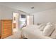 Cozy bedroom with a dresser, tv, and access to the bathroom and other rooms in the home at 1201 N Buffalo Dr # 202, Las Vegas, NV 89128