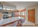 Modern kitchen features stainless appliances, a breakfast bar, and bright lighting at 1201 N Buffalo Dr # 202, Las Vegas, NV 89128