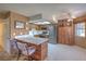Beautiful eat-in kitchen featuring tile floors, stainless steel appliances, and custom cabinets at 1201 N Buffalo Dr # 202, Las Vegas, NV 89128