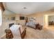 Comfortable living room with a fireplace, neutral decor, and a view into other spaces at 1201 N Buffalo Dr # 202, Las Vegas, NV 89128