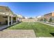 Enjoy the backyard with new artificial turf, desert landscaping and a covered patio area, perfect for outdoor relaxation at 1208 Neva Ranch Ave, North Las Vegas, NV 89081