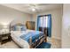 Comfortable bedroom featuring an iron bed frame, and window with shade at 1208 Neva Ranch Ave, North Las Vegas, NV 89081