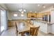 Bright dining area with granite counters, stainless steel appliances, tile floors, and sliding door access to the backyard at 1208 Neva Ranch Ave, North Las Vegas, NV 89081
