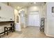 Bright entryway with tile floors, tall ceilings, and convenient furniture at 1208 Neva Ranch Ave, North Las Vegas, NV 89081