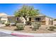 Single-story home featuring low-maintenance landscaping and a covered entryway at 1208 Neva Ranch Ave, North Las Vegas, NV 89081
