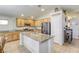 Kitchen with light-colored cabinets, granite countertops, stainless steel appliances, and a pantry at 1208 Neva Ranch Ave, North Las Vegas, NV 89081
