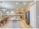 Bright kitchen with stainless steel appliances, granite countertops, a large island and breakfast bar seating at 1208 Neva Ranch Ave, North Las Vegas, NV 89081