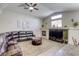 Spacious living room boasting a fireplace, vaulted ceilings, and tile flooring at 1208 Neva Ranch Ave, North Las Vegas, NV 89081
