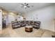 Spacious living room showcasing a large sectional and seamless flow into the entryway at 1208 Neva Ranch Ave, North Las Vegas, NV 89081
