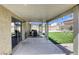 Spacious covered patio area for outdoor living and entertaining, seamlessly connecting the indoors with the backyard at 1208 Neva Ranch Ave, North Las Vegas, NV 89081