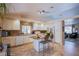 Bright eat-in kitchen with white cabinetry, a center island, and stainless steel appliances at 151 Enloe St, Henderson, NV 89074