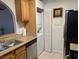 Kitchen area with dishwasher and compact washer/dryer unit at 1515 E Reno Ave # C207, Las Vegas, NV 89119