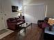 Comfortable living room featuring laminate flooring and a full-size sofa at 1515 E Reno Ave # C207, Las Vegas, NV 89119