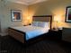 Comfortable bedroom features a king bed with luxurious bedding and warm lighting at 2000 N Fashion Show Dr # 2627, Las Vegas, NV 89109