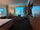 Comfortable bedroom suite with a sitting area and city views at 2000 N Fashion Show Dr # 2627, Las Vegas, NV 89109