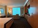 Bright bedroom suite with expansive windows offering city views at 2000 N Fashion Show Dr # 2627, Las Vegas, NV 89109