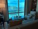 Relaxing living area features a comfortable seating arrangement and city views at 2000 N Fashion Show Dr # 2627, Las Vegas, NV 89109