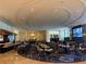 Elegant restaurant featuring tables with chairs and booths, a long bar, and recessed ceiling lights at 2000 N Fashion Show Dr # 2627, Las Vegas, NV 89109
