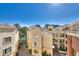 A serene view of the building's architecture, showcasing the beautiful pool and sunny blue skies at 230 E Flamingo Rd # 229, Las Vegas, NV 89169