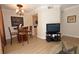 Comfortable living room with adjacent dining area featuring hardwood floors and recessed lighting at 230 E Flamingo Rd # 229, Las Vegas, NV 89169